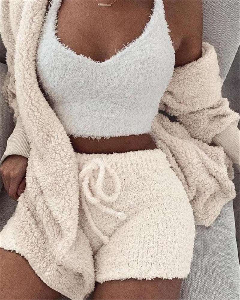 Cozy 3 piece women's sleepwear set with a fuzzy crop top, shorts, and a matching cardigan in cream color